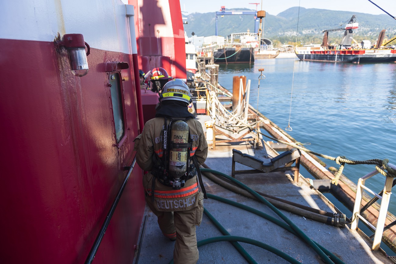 A firefighters practise marine firefighting drills at Seaspan.