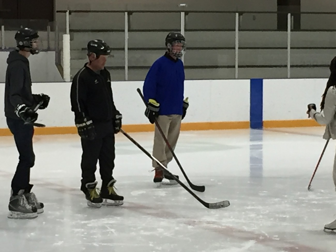 Mayor Walton playing hockey at Karen Magnussen Community Recreation Centre