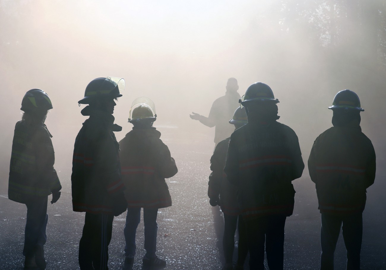 Group of fire firefighters surrounded by smoke