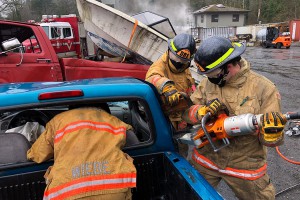 Firefighters practice extracting victims from vehicle accidents.