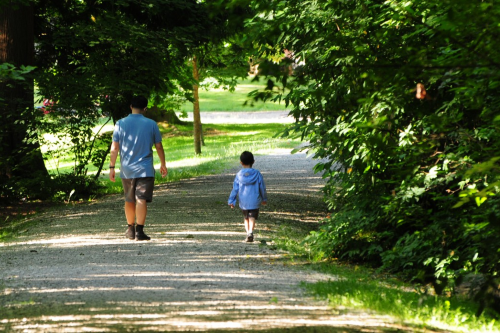 Man and child walking along a trail in Bridgman Park