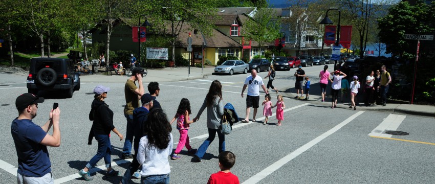 Families on the street in Deep Cove
